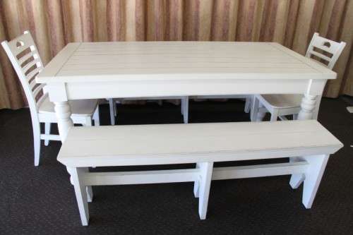 A wonderful white 6-seater solid wooden kitchen/ patio dining table with two benches and two chairs