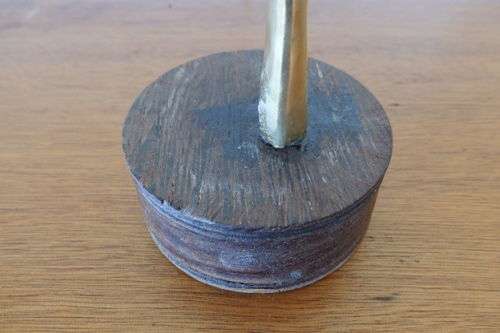 A wonderful tall solid brass abstract figurine mounted on a wooden base in great condition