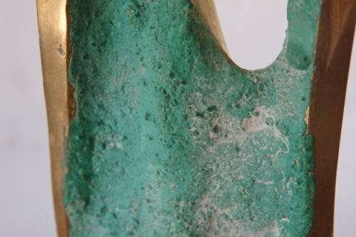 A wonderful tall solid brass abstract figurine mounted on a wooden base in great condition