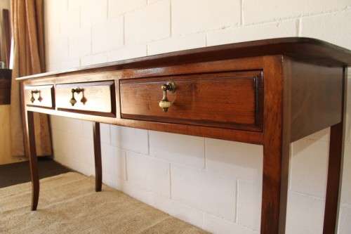 Spectacular teak buffet console/hall table with three spacious drawers in remarkable condition