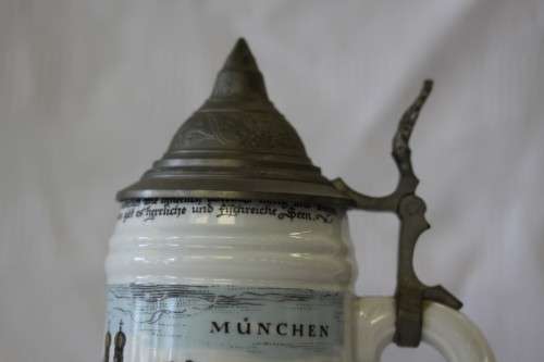 An awesome vintage white German made ceramic (lidded) Stein with "Munich" related transfer prints
