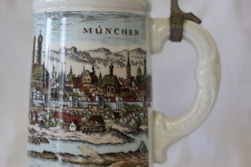 An awesome vintage white German made ceramic (lidded) Stein with "Munich" related transfer prints