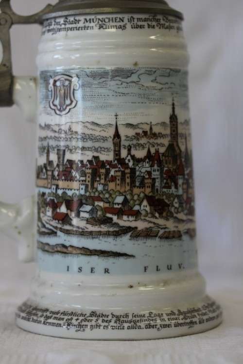 An awesome vintage white German made ceramic (lidded) Stein with "Munich" related transfer prints