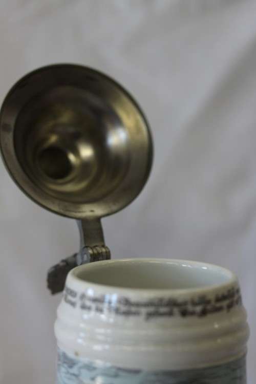 An awesome vintage white German made ceramic (lidded) Stein with "Munich" related transfer prints
