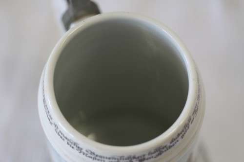 An awesome vintage white German made ceramic (lidded) Stein with "Munich" related transfer prints