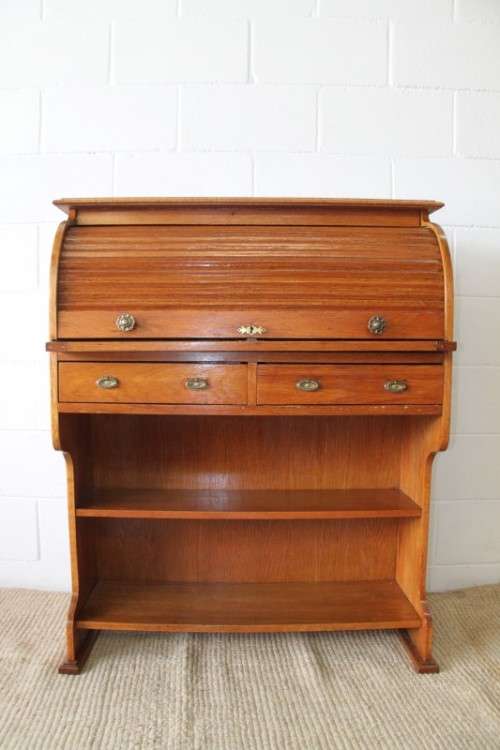 An incredible vintage solid oak roll top writing bureau with pull out writing top - very compact!