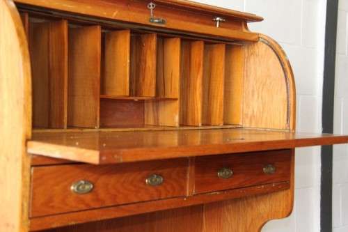 An incredible vintage solid oak roll top writing bureau with pull out writing top - very compact!