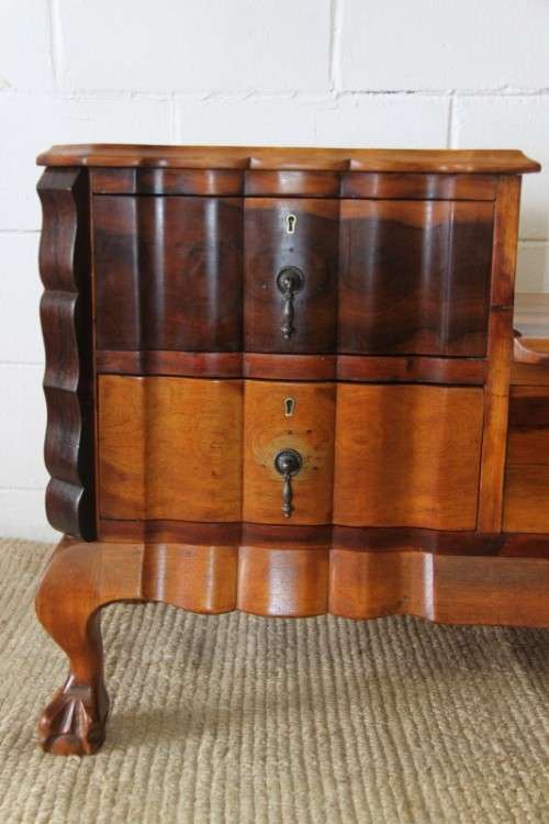 A fabulous, elegant and solid stinkwood ball & claw dresser with five drawers and carved trimmings