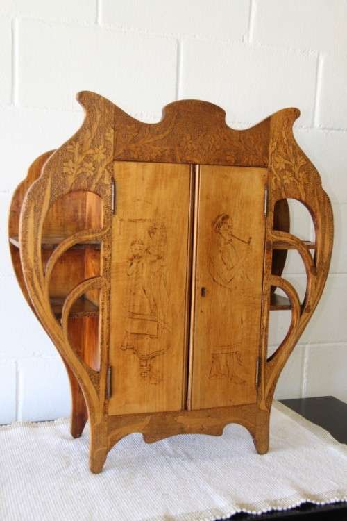 An incredible rare antique German Art Nouveau Apothecary wall cabinet with stunning carved detailing
