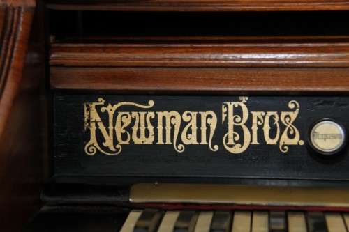 A spectacular rare antique Victorian (1902 - 1920) Newman Bros high back parlor reed organ