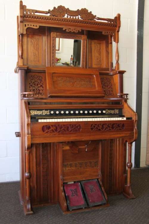 A spectacular rare antique Victorian (1902 - 1920) Newman Bros high back parlor reed organ