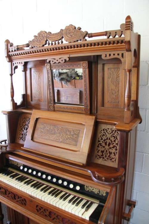 A spectacular rare antique Victorian (1902 - 1920) Newman Bros high back parlor reed organ