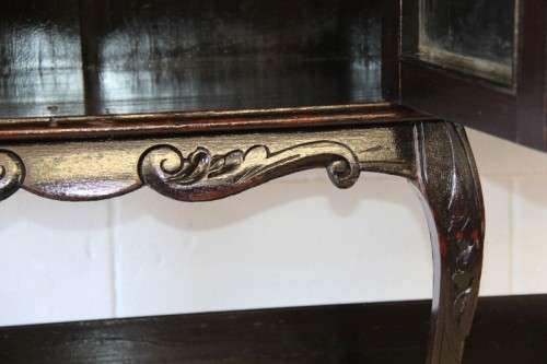 A magnificent display cabinet with a beveled mirror, cupboards and loads of shelf space