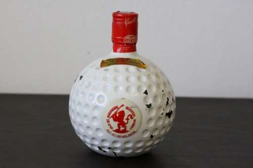 A rare SEALED vintage "Old St. Andrews" Scotch Whisky "Red-top" golf ball whisky decanter