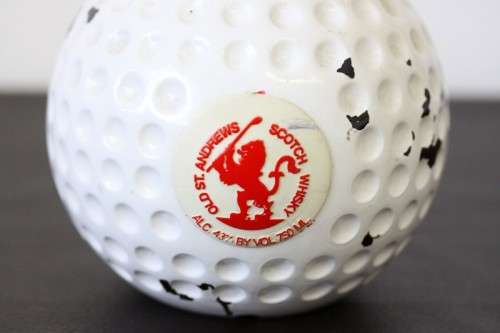 A rare SEALED vintage "Old St. Andrews" Scotch Whisky "Red-top" golf ball whisky decanter