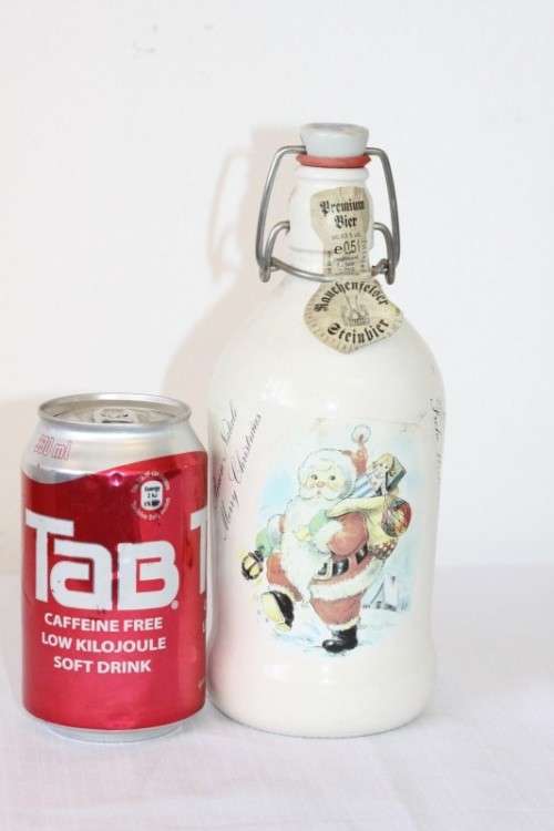 An awesome vintage German "Rauchenfelser Steinbier" porcelain Xmas commemorative flip-top decanter