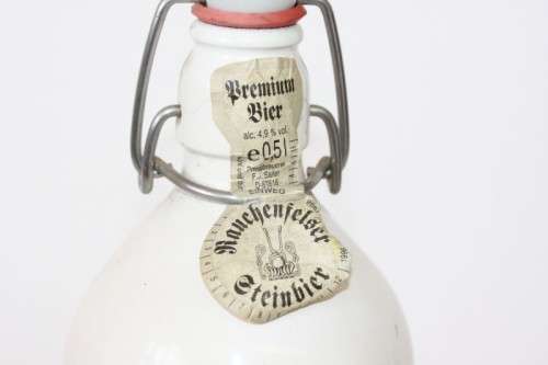 An awesome vintage German "Rauchenfelser Steinbier" porcelain Xmas commemorative flip-top decanter