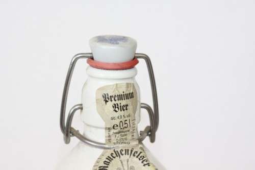 An awesome vintage German "Rauchenfelser Steinbier" porcelain Xmas commemorative flip-top decanter