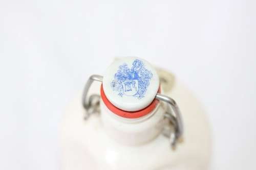 An awesome vintage German "Rauchenfelser Steinbier" porcelain Xmas commemorative flip-top decanter