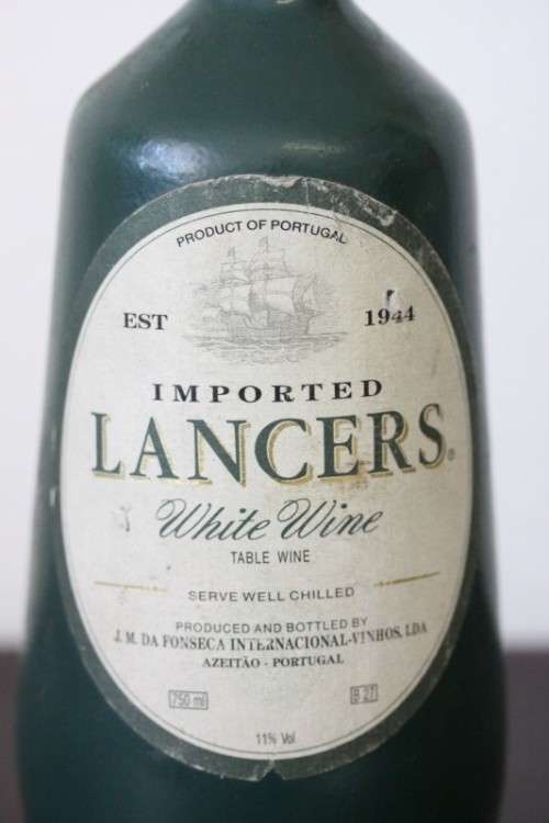 An awesome and very collectable vintage "Lancers" White wine in a stoneware decanter