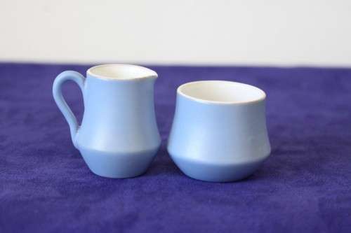A gorgeous "Tea-For-Two" terracotta stoneware milk jug/ creamer and sugar bowl set in a soft blue