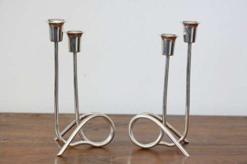 Two beautiful "modern" styled silver plated candle holders with an elegant design - bid/holder
