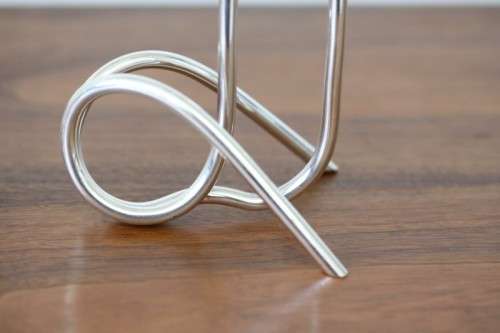 Two beautiful "modern" styled silver plated candle holders with an elegant design - bid/holder