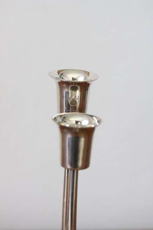 Two beautiful "modern" styled silver plated candle holders with an elegant design - bid/holder