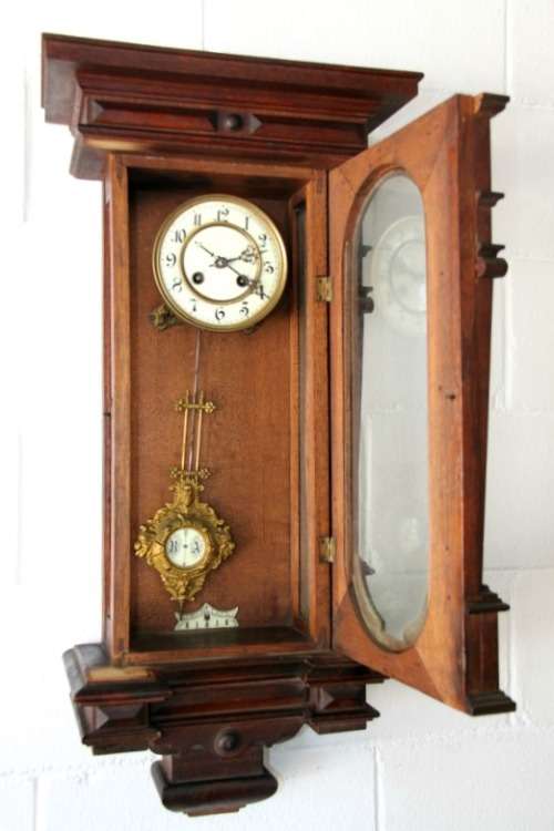 A spectacular antique (c.1890) German regulatory pendulum wall clock with a porcelain clock face