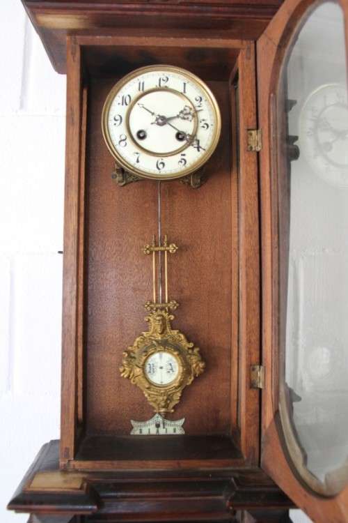 A spectacular antique (c.1890) German regulatory pendulum wall clock with a porcelain clock face