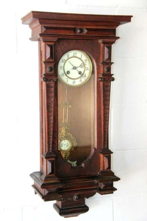 A spectacular antique (c.1890) German regulatory pendulum wall clock with a porcelain clock face