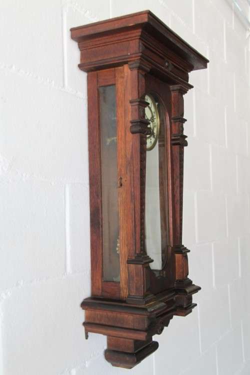 A spectacular antique (c.1890) German regulatory pendulum wall clock with a porcelain clock face
