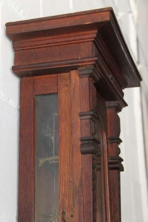 A spectacular antique (c.1890) German regulatory pendulum wall clock with a porcelain clock face