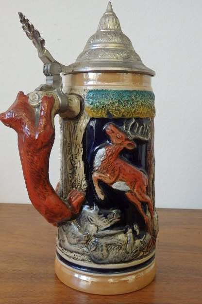 A fabulous vintage German made stoneware (lidded) Stein w/ traditional hand glazed detailing