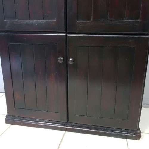 A wonderful dark stained four-door TV entertainment unit with ample space for components
