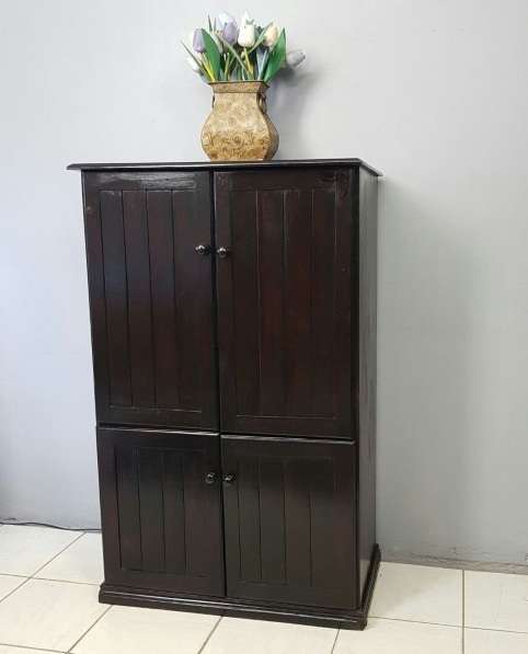 A wonderful dark stained four-door TV entertainment unit with ample space for components