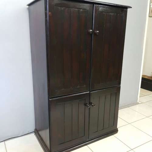 A wonderful dark stained four-door TV entertainment unit with ample space for components