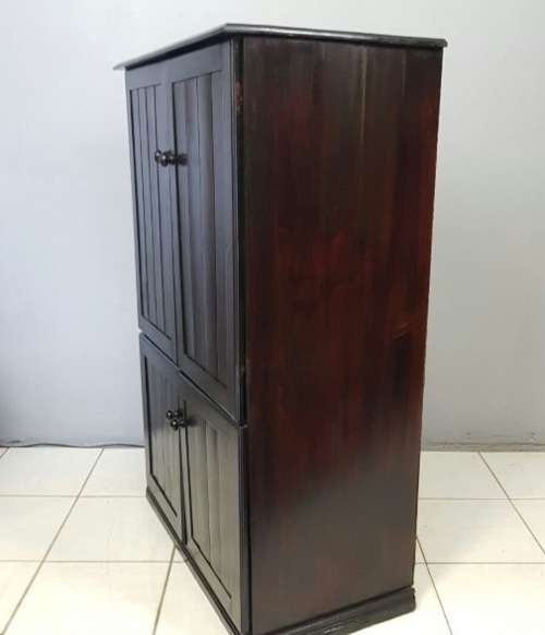 A wonderful dark stained four-door TV entertainment unit with ample space for components
