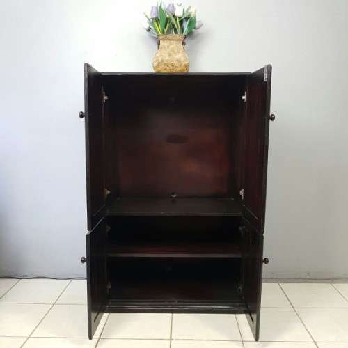 A wonderful dark stained four-door TV entertainment unit with ample space for components