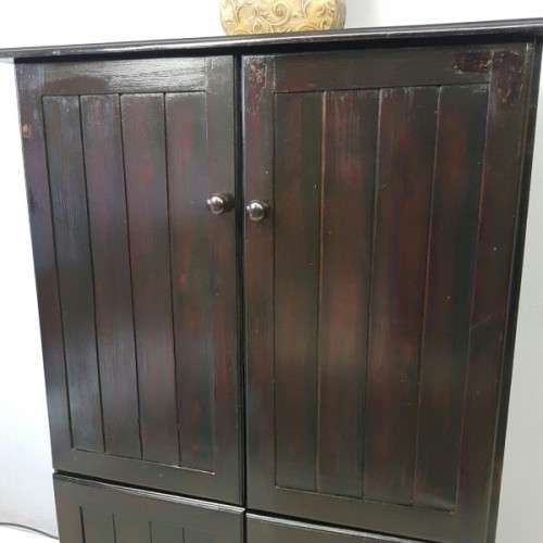 A wonderful dark stained four-door TV entertainment unit with ample space for components