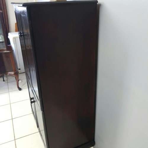A wonderful dark stained four-door TV entertainment unit with ample space for components