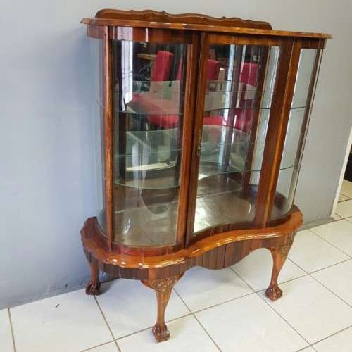 A beautiful antique curved glass ball & claw showcase w/ shelves, all glass intact!!! Exquisite!!!