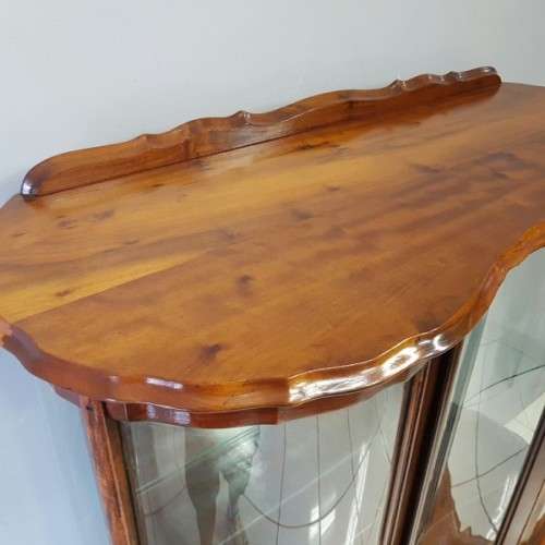 A beautiful antique curved glass ball & claw showcase w/ shelves, all glass intact!!! Exquisite!!!