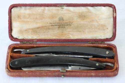 A superb set of antique "The Alexander Clark Co Ltd" cut throat razors in their original box