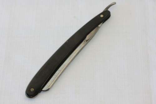 An amazing rare antique "J.A Kenckels Solingen" German cut throat razor in its original box
