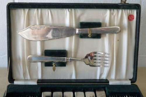 An amazing vintage Yeoman Art Deco fish knife and fork set w/ matching knife and fork serving set