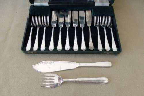 An amazing vintage Yeoman Art Deco fish knife and fork set w/ matching knife and fork serving set