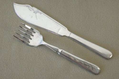 An amazing vintage Yeoman Art Deco fish knife and fork set w/ matching knife and fork serving set