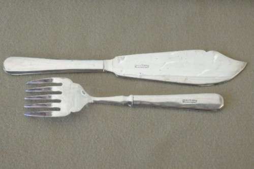 An amazing vintage Yeoman Art Deco fish knife and fork set w/ matching knife and fork serving set