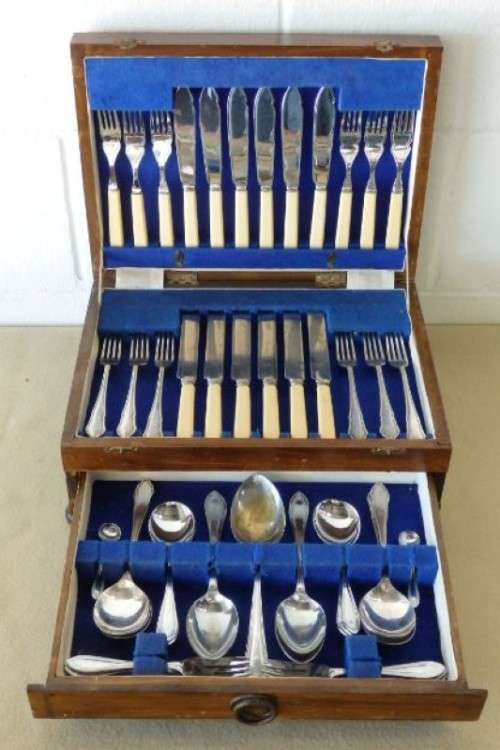 A wonderful vintage 52 piece cutlery set in a stunning vintage 3-division wooden canteen